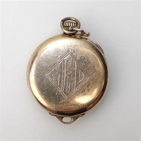 Aside from the transparent crystal, there is nothing covering the face of the <b>pocket</b> <b>watch</b>, allowing the time to be read without opening any covers. . Wadsworth pocket watch case identification